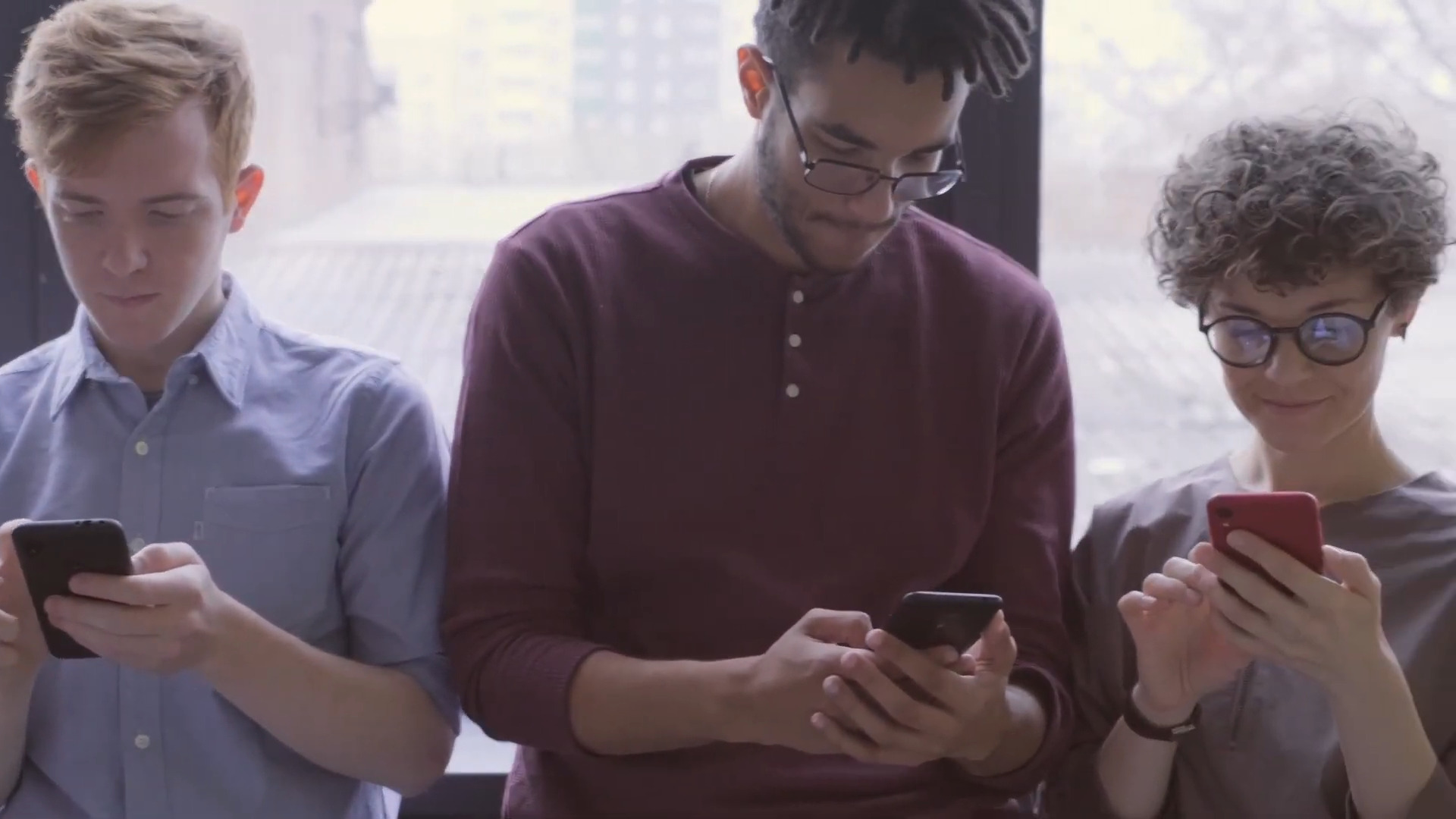 People using their mobile phones